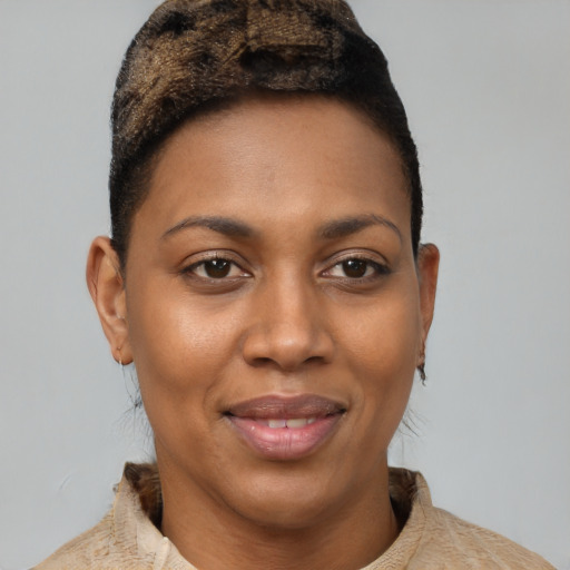 Joyful black young-adult female with short  brown hair and brown eyes