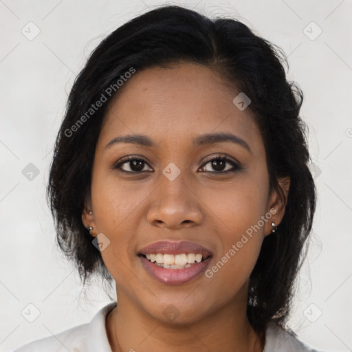 Joyful black young-adult female with long  brown hair and brown eyes