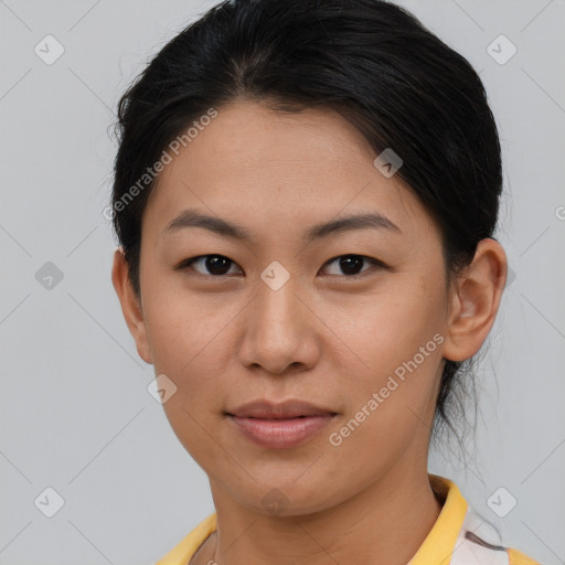 Joyful asian young-adult female with short  brown hair and brown eyes