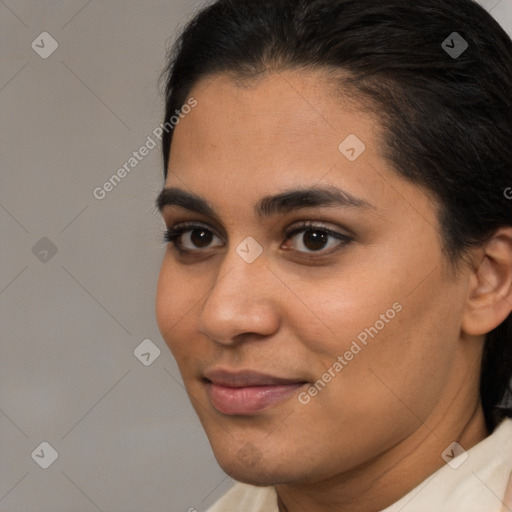 Joyful latino young-adult female with short  brown hair and brown eyes