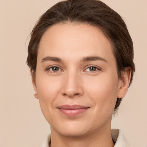 Joyful white young-adult female with short  brown hair and brown eyes