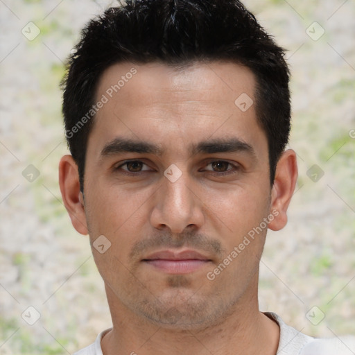Joyful white young-adult male with short  black hair and brown eyes