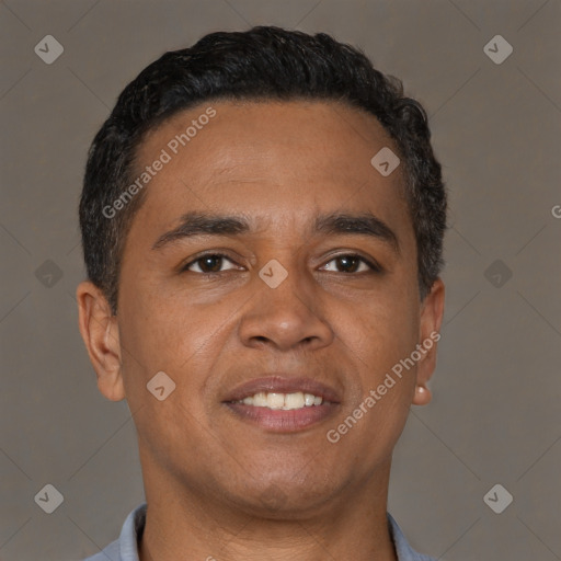 Joyful latino young-adult male with short  brown hair and brown eyes