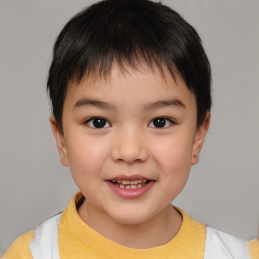 Joyful white child male with short  brown hair and brown eyes