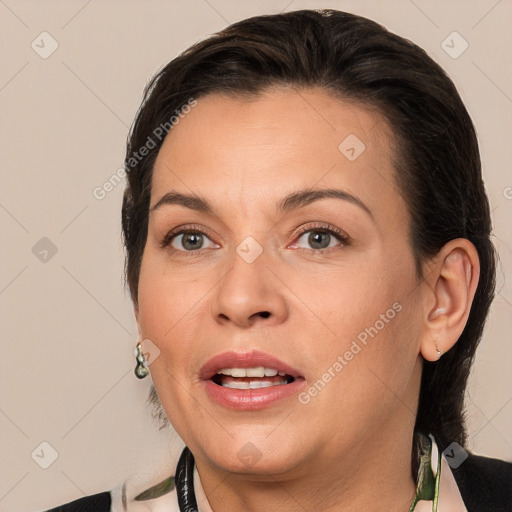 Joyful white adult female with medium  brown hair and brown eyes