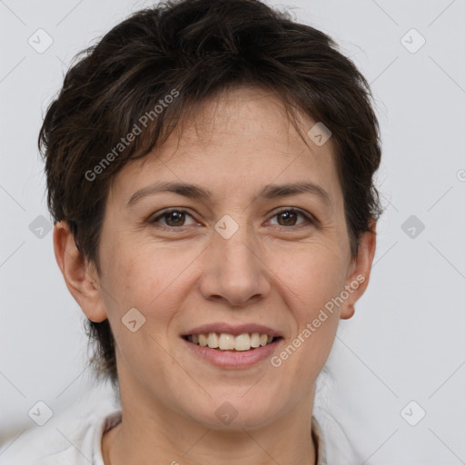 Joyful white adult female with short  brown hair and brown eyes