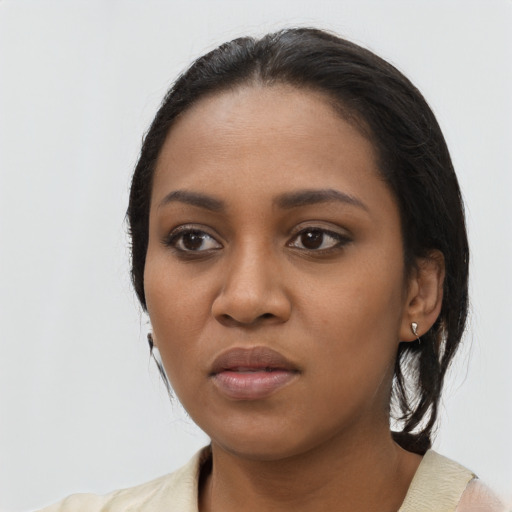 Neutral black young-adult female with long  black hair and brown eyes