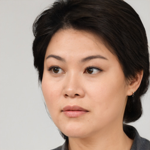Neutral asian young-adult female with medium  brown hair and brown eyes