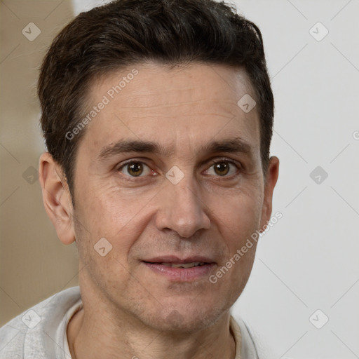 Joyful white adult male with short  brown hair and brown eyes