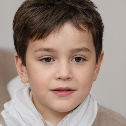 Joyful white child male with short  brown hair and brown eyes