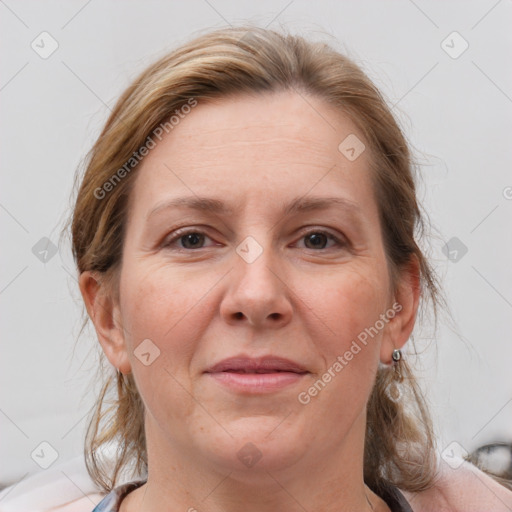 Joyful white adult female with medium  brown hair and grey eyes