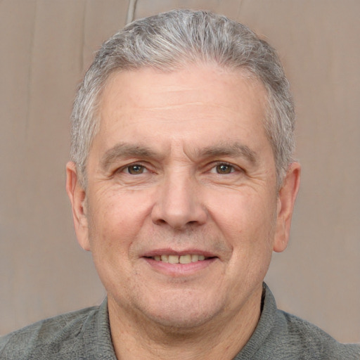 Joyful white middle-aged male with short  gray hair and grey eyes