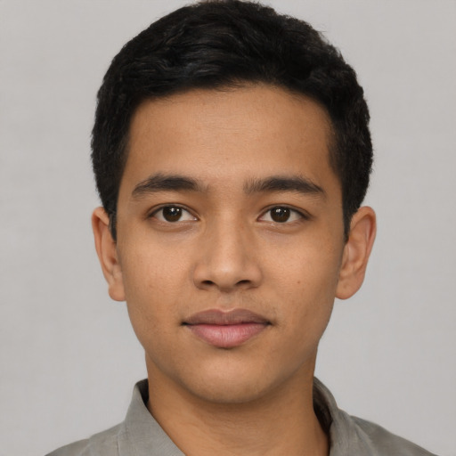 Neutral latino young-adult male with short  black hair and brown eyes