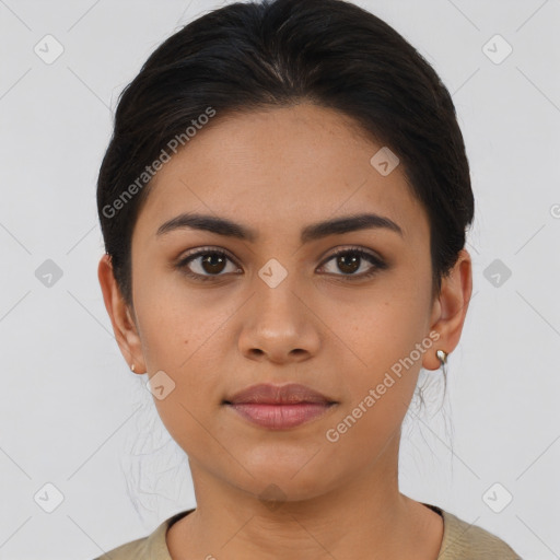 Joyful latino young-adult female with short  brown hair and brown eyes