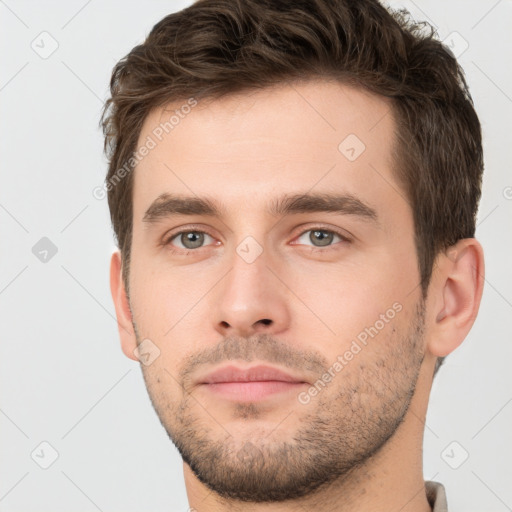 Neutral white young-adult male with short  brown hair and brown eyes