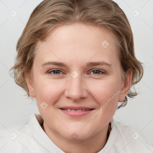 Joyful white young-adult female with medium  brown hair and blue eyes