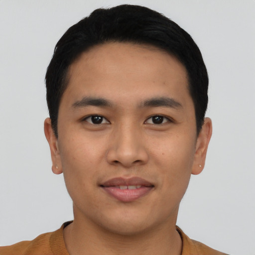 Joyful asian young-adult male with short  black hair and brown eyes