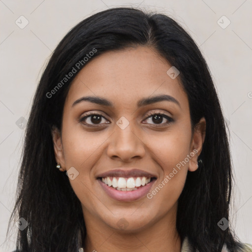 Joyful latino young-adult female with long  black hair and brown eyes