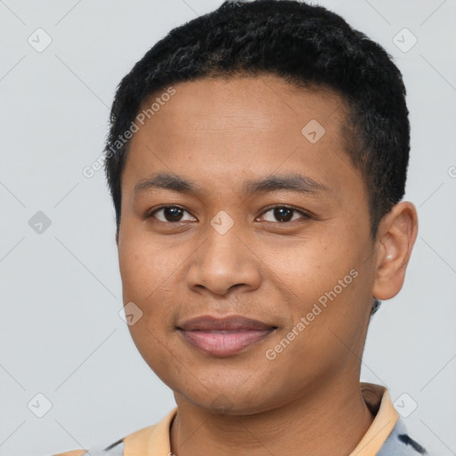 Joyful latino young-adult male with short  brown hair and brown eyes