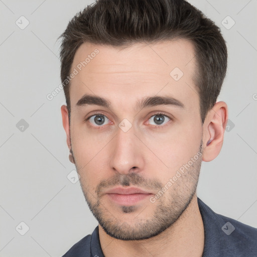 Neutral white young-adult male with short  brown hair and brown eyes