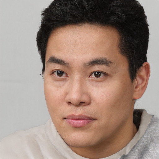 Neutral asian young-adult male with short  brown hair and brown eyes