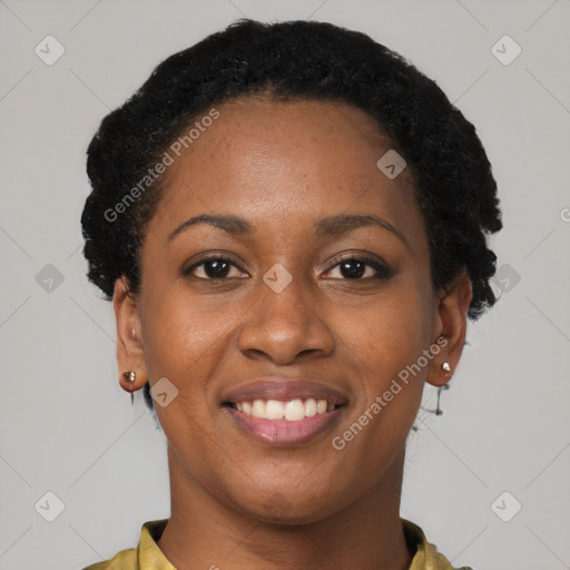 Joyful black young-adult female with short  brown hair and brown eyes