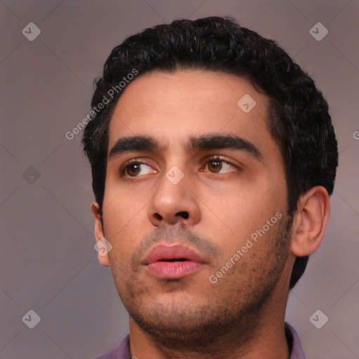 Neutral white young-adult male with short  black hair and brown eyes