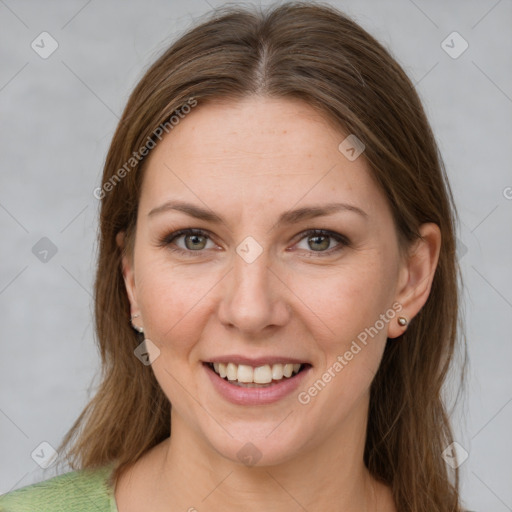 Joyful white young-adult female with medium  brown hair and grey eyes