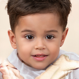 Joyful white child male with short  brown hair and brown eyes