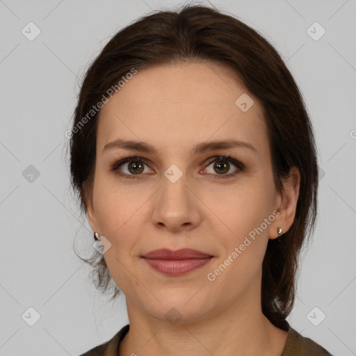 Joyful white adult female with medium  brown hair and brown eyes