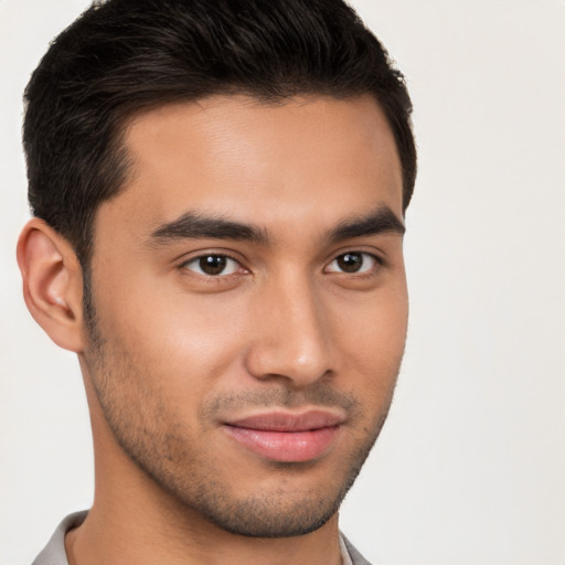 Joyful white young-adult male with short  brown hair and brown eyes