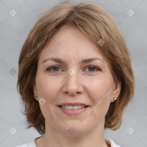 Joyful white adult female with medium  brown hair and grey eyes