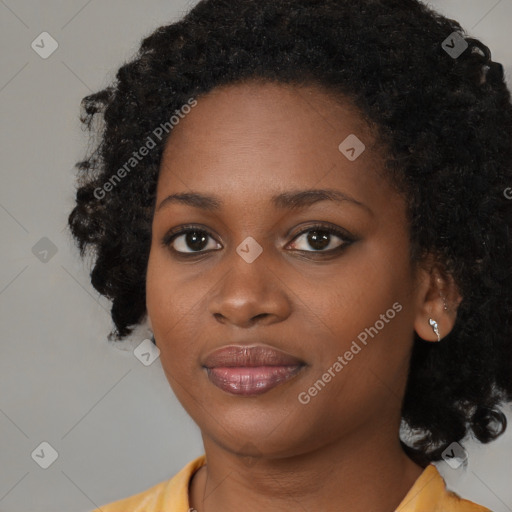 Joyful black young-adult female with medium  black hair and brown eyes