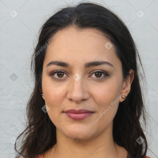 Joyful latino young-adult female with long  brown hair and brown eyes