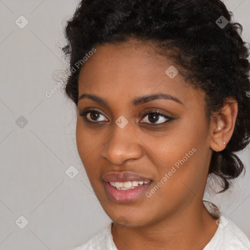 Joyful black young-adult female with medium  black hair and brown eyes