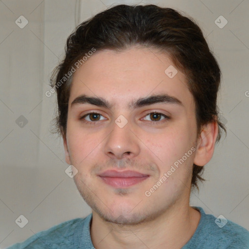 Joyful white young-adult male with medium  brown hair and brown eyes