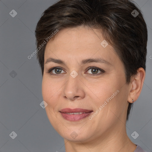 Joyful white adult female with medium  brown hair and brown eyes