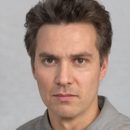 Neutral white adult male with short  brown hair and brown eyes