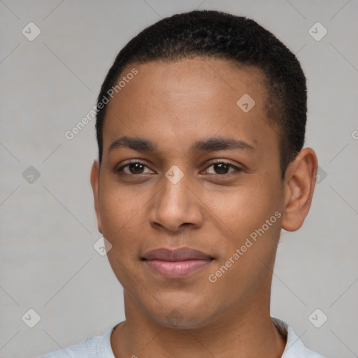 Joyful latino young-adult male with short  brown hair and brown eyes