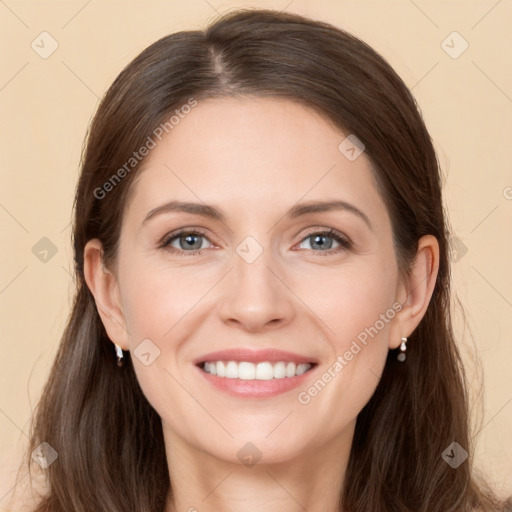 Joyful white young-adult female with long  brown hair and grey eyes