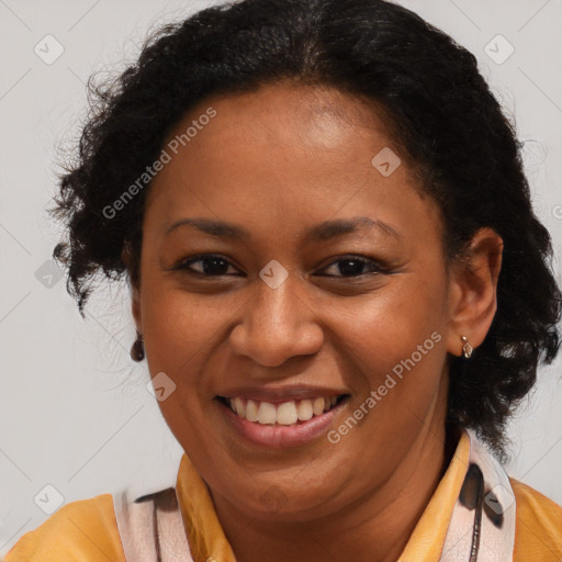 Joyful latino adult female with medium  brown hair and brown eyes