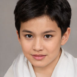 Joyful asian child female with short  brown hair and brown eyes