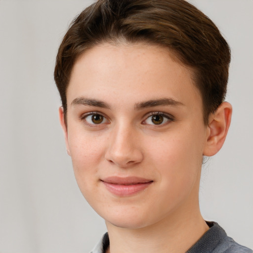 Joyful white young-adult female with short  brown hair and grey eyes