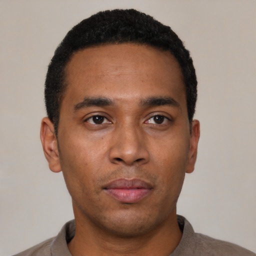 Neutral black young-adult male with short  black hair and brown eyes