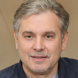 Joyful white middle-aged male with short  brown hair and brown eyes