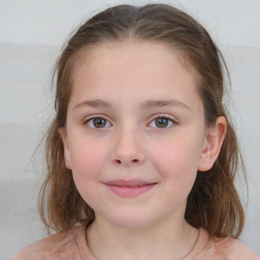 Joyful white child female with medium  brown hair and brown eyes