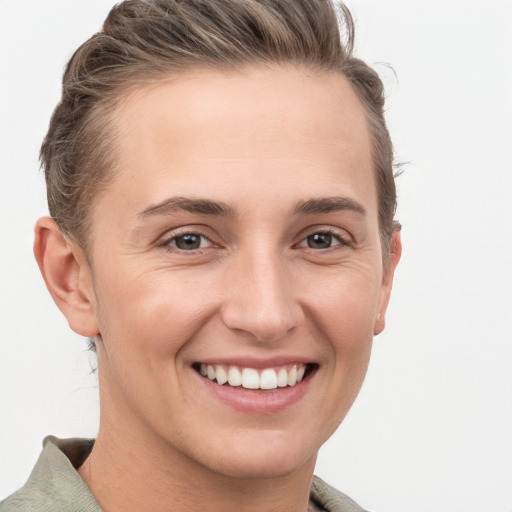 Joyful white young-adult female with short  brown hair and grey eyes