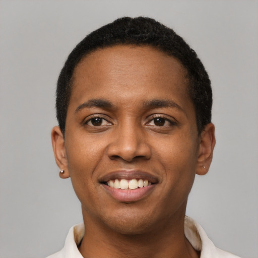 Joyful black young-adult male with short  black hair and brown eyes