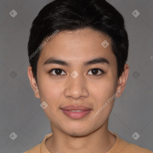 Joyful asian young-adult male with short  brown hair and brown eyes