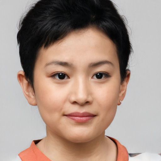 Joyful asian young-adult female with short  brown hair and brown eyes